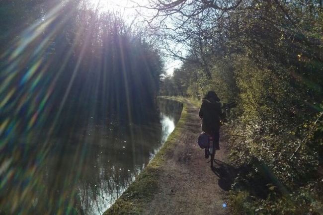 Robyn cycling along the towpath